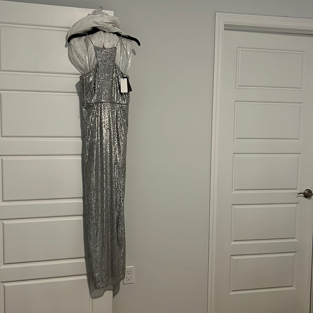 Beautiful never worn silver sequin gown by Adrianna Papell. Size 4P